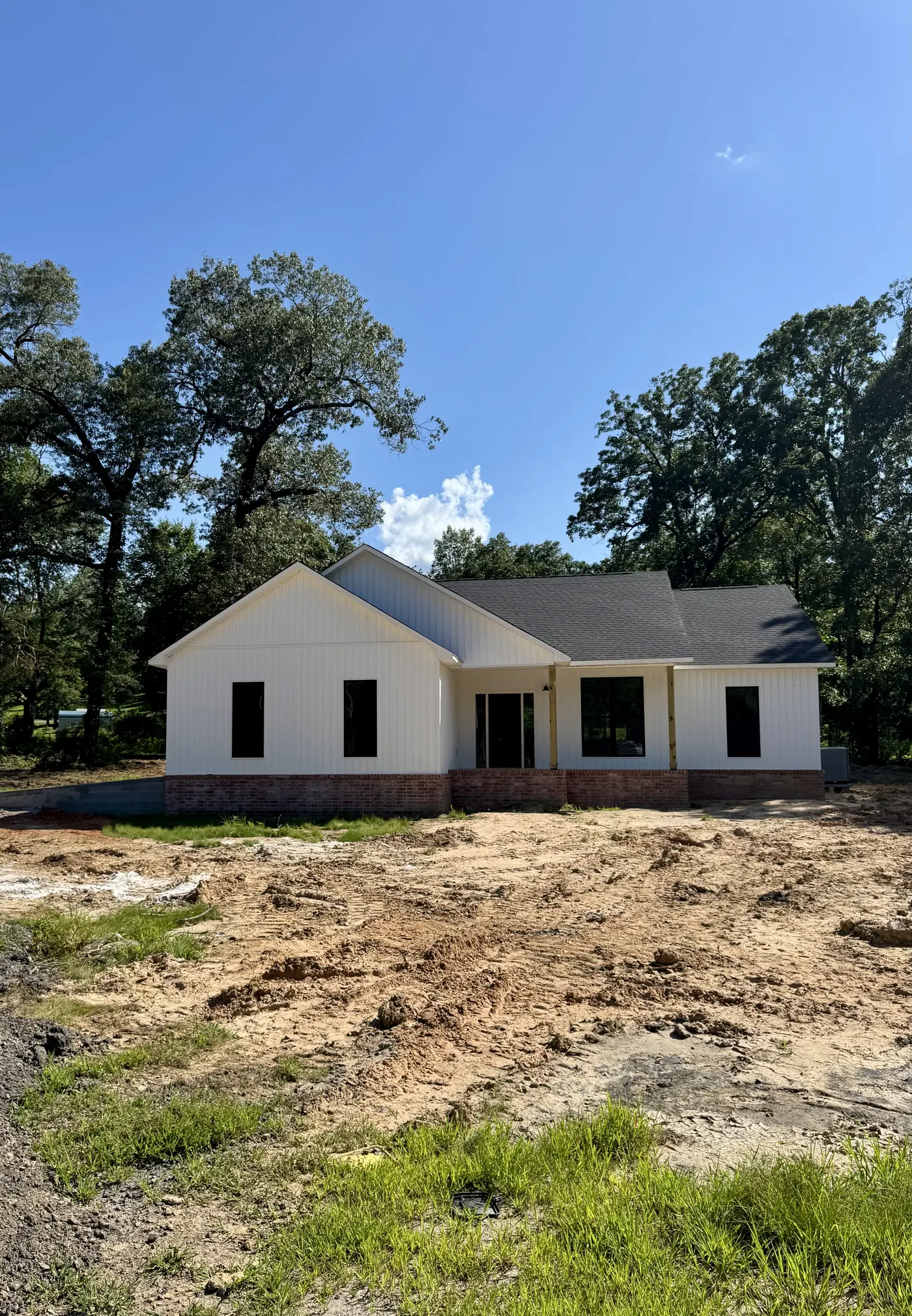 White board-and-batten farmhouse with covered front porch
