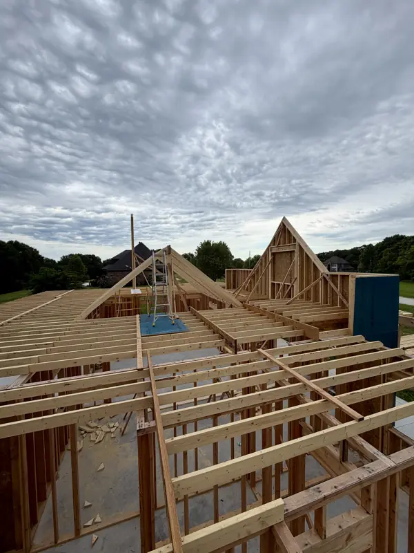 Roof gables and ceiling joists being framed on the gabled new build