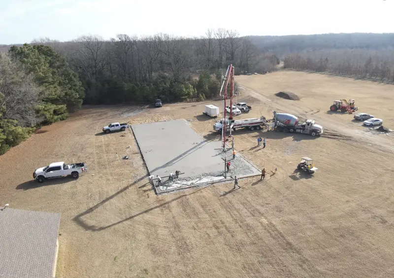 Aerial view of a slab pour with the pump truck on site
