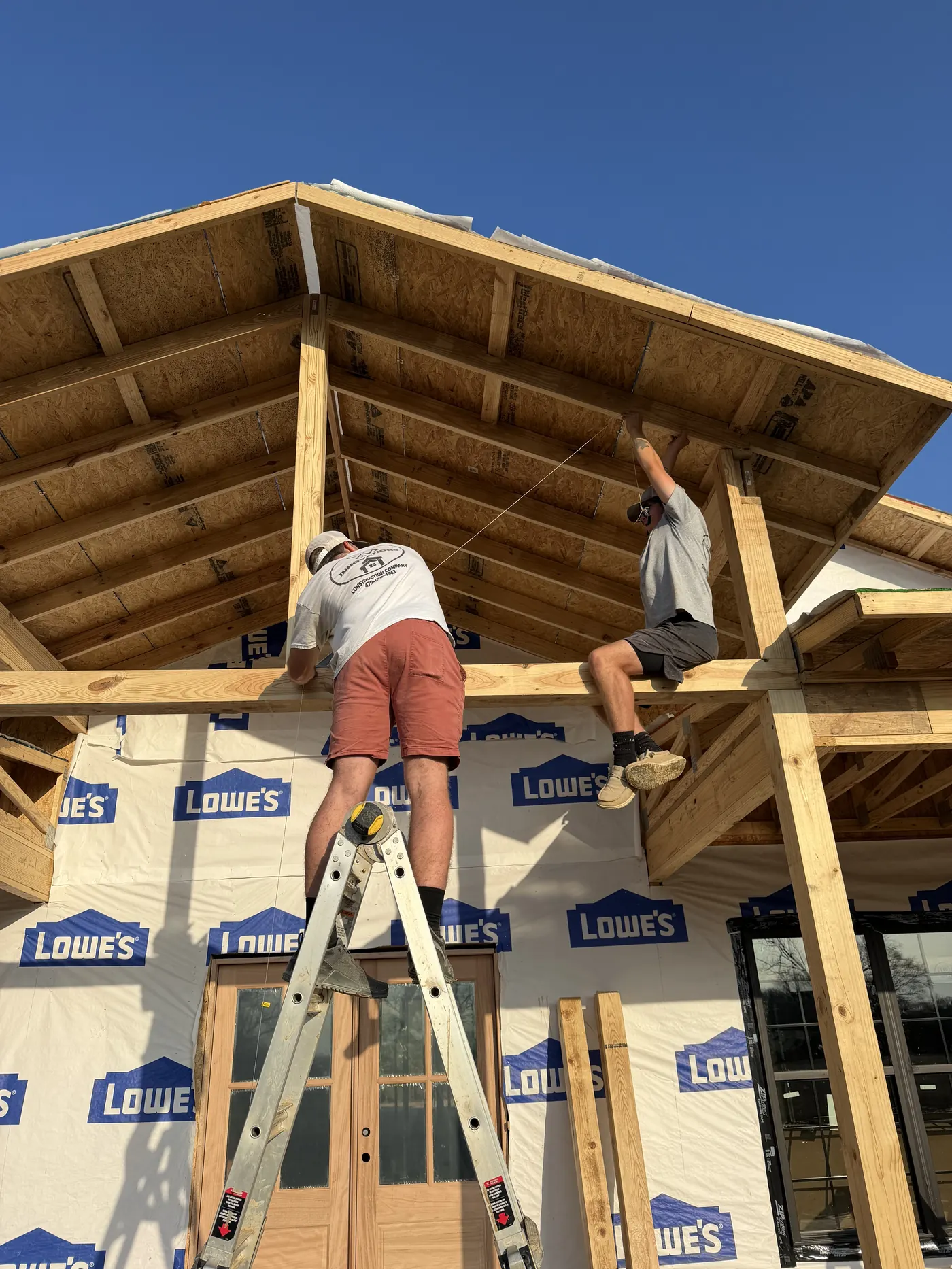 C&M Innovations crew framing a timber porch roof